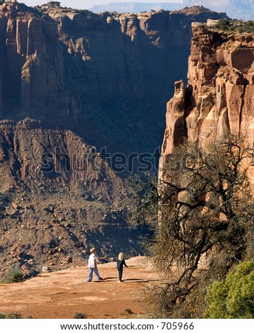 Two youngsters scamper along the high mesa in Canyonlands
