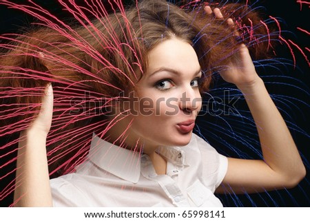 Girl dishevelled hair light lines from hair