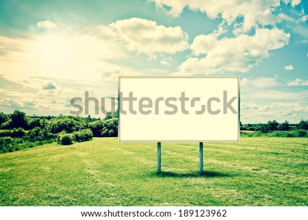 Beautiful countryside landscape with a billboard sign