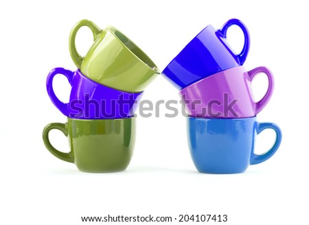 six cups on a white background, separately. ceramic ware for tea, coffee. The cup costs in the cup, one in other.