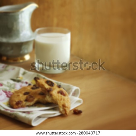 Blurring background with cookies and milk. The basis for the advertising poster, the layout for the confectionery, bakery, food, healthy food with space for text