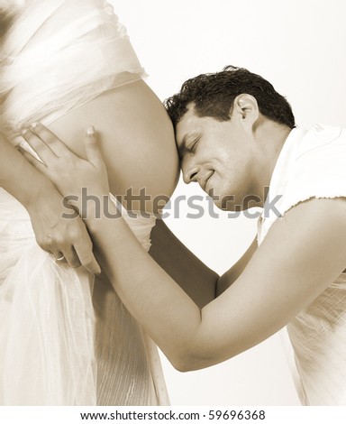 beautiful young  pregnant woman in white clothes and man