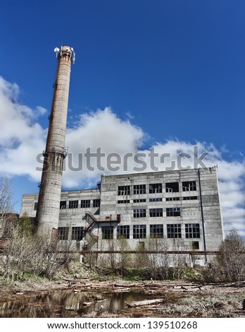 The old boiler house on the sky background.
