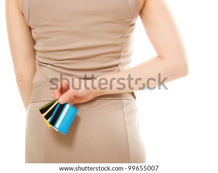 Woman with many different credit cards behind his back.