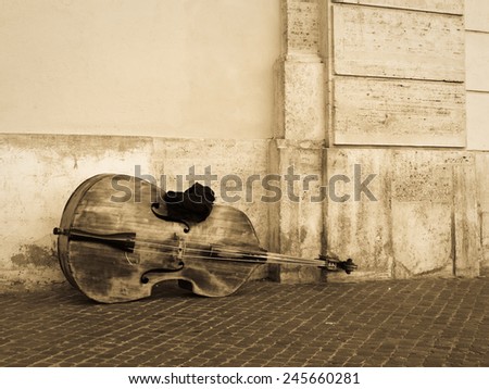 A cello or contrabass left out on the street before playing