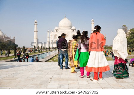 Agra, India - January 10, 2015 : Tourists visiting the famous Taj Mahal, a Mughal landmark in Agra, India