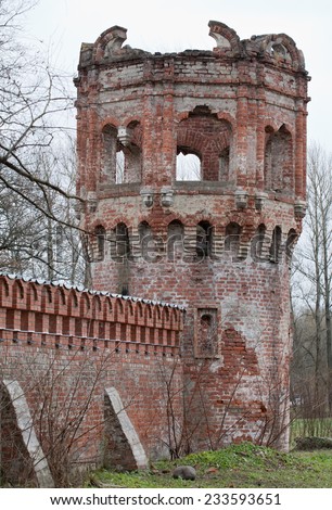 old damaged and abandoned fortress red brick tower closeup