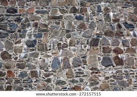 old fortress wall made from big stones masonry pattern background