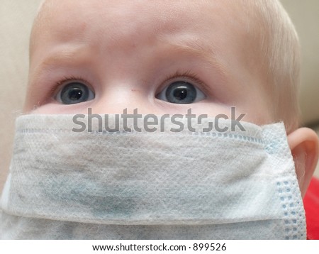 little baby in a medical mask