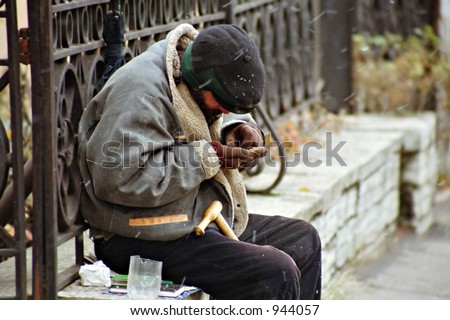 beggar counting his proceeds, soft focus and snow noise