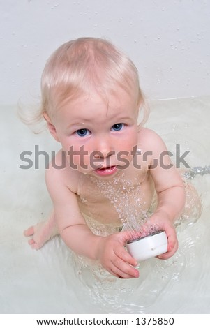 stock photo : funny baby in bath with shower. Save to a lightbox ▼