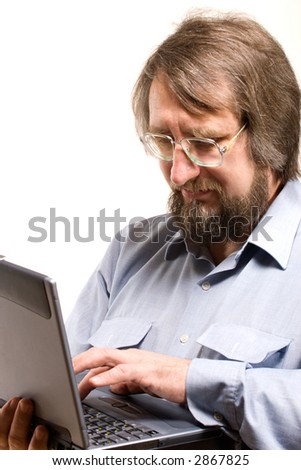 businessman in glasses printing on his notebook on white background