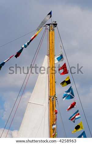 ship mast with sea holiday flags