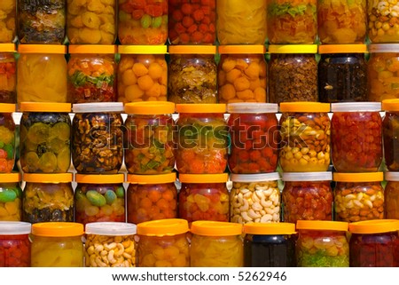a lot of jars with assorted canned fruits