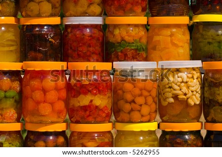 a lot of jars with assorted canned fruits
