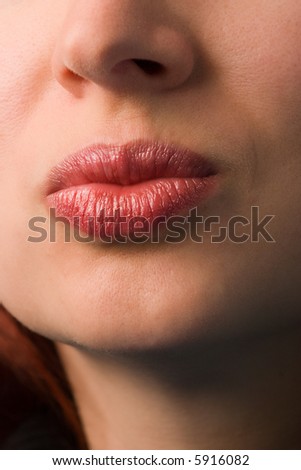 beautiful woman lips close-up shot. vertical orientation
