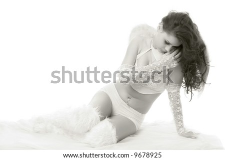 beautiful womanin white dress and angel wings on the back isolated on white