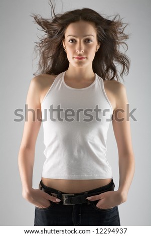 stock photo beautiful young model in white tshirt and jeans on grey 