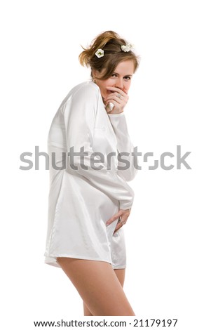 beautiful confused girl in white clothes covers a mouth with a hand, isolated on white