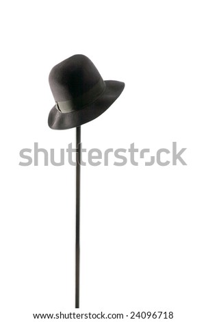 black hat hangs on  metal hanger, isolated