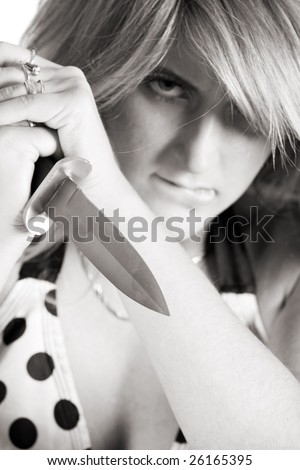 beautiful aggressive woman with dagger in hands