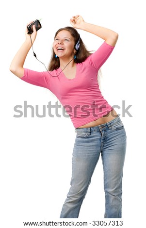 Beautiful happy woman in pink jacket and jeans dance with music player, isolated on white