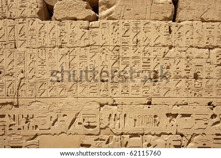 Egyptian hieroglyphs on the wall of ancient temple, Luxor, Karnak Temple