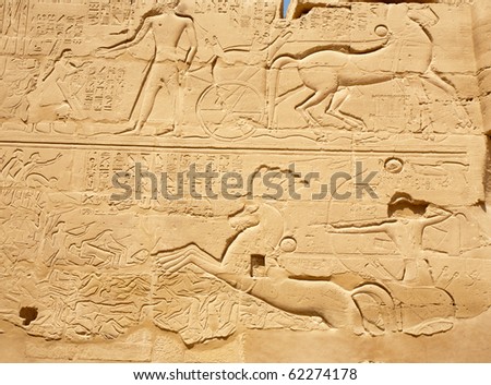 ancient Egyptian bas-reliefs on the wall of Karnak Temple, Egypt, Luxor
