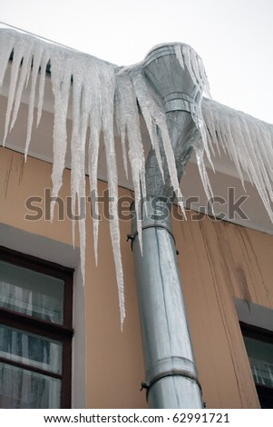 big dangerous icicles hanging down the roof