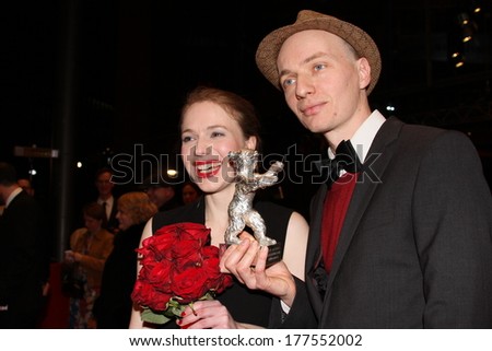BERLIN, GERMANY - FEBRUARY 15: Anna, Dietrich Brueggemann poses with his Silver Bear for Best  after the closing ceremony during Berlinale Festival at Palast on February 15, 2014 in Berlin, Germany.