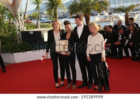 .CANNES, FRANCE - MAY 24:  Claire Burger, Samuel Theis pose with the Camera d\'Or attend the Palme D\'Or Winners photocall during the 67th  Cannes Film Festival on May 24, 2014 in Cannes, France.