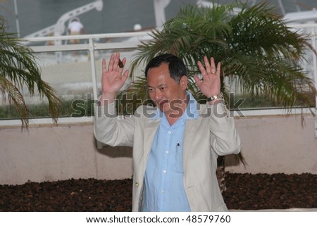 CANNES, FRANCE - MAY 14: Director Johnny To  attends a photo call promoting the film \'Election\' at the Palais during the 58th International Cannes Film Festival May 14, 2005 in Cannes, France