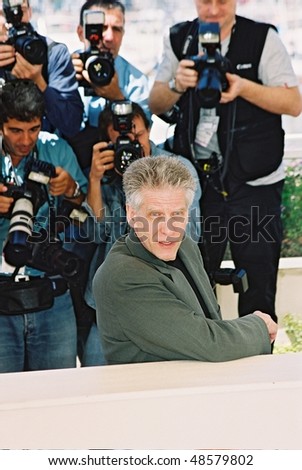 CANNES, FRANCE - MAY 21: Canadian director David Cronenberg poses during a photocall for his film \'Spider\' during the 55th Cannes Film Festival May 21, 2002 in Cannes, France