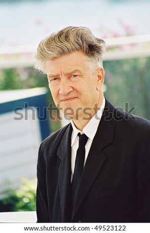 CANNES, FRANCE - MAY 15: The jury\'s president of the 55th Cannes Film Festival,  David Lynch, poses for photographers during a photocall  of the Palais des festivals May 15,  2002 in Cannes, France
