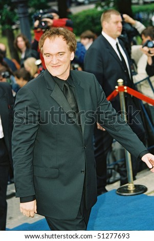 MOSCOW, RUSSIA - JUNE 18: US director Quentin Tarantino gestures during the opening ceremony of the XXVI Moscow international film festival at Russia\'s cinema hall on June 18,  2004 in Moscow, Russia