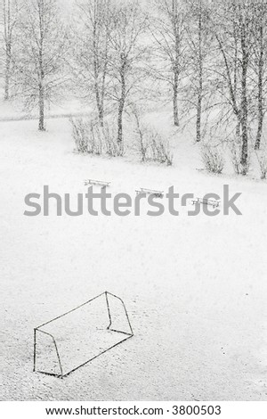 School football ground while snowfalling