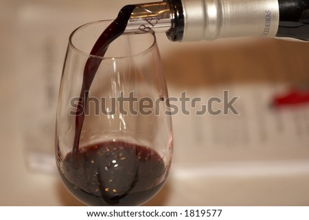 Red wine poured during a wine tasting