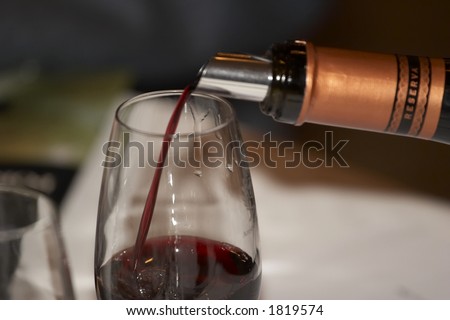 Red wine poured during a wine tasting
