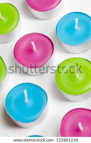 a group colored tealight candles