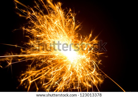 a picture of a burning sparkler