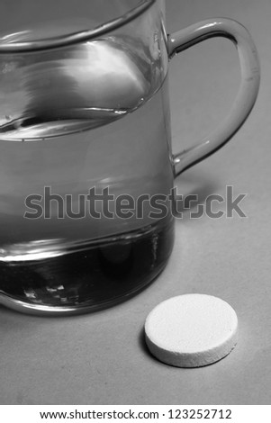 effervescent tablets and a glass