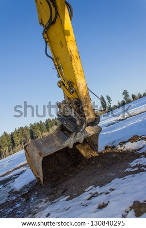 new excavator in the snow