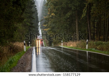 rainy countryside street with traffic