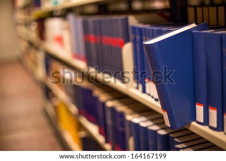 plain book jut out a bookshelf