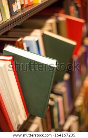 plain book jut out a bookshelf