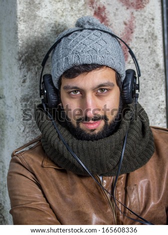 beard man hearing music