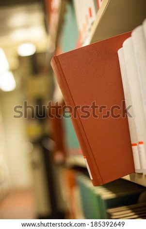 a plain book in a bookshelf