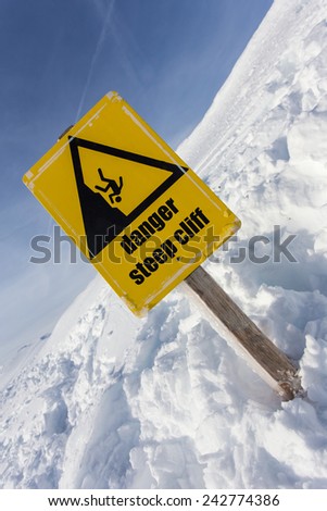 danger steep cliff mountain sign