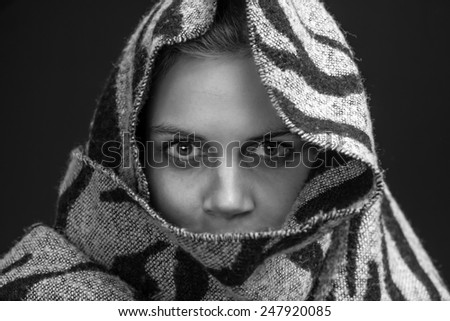 young woman with a scarf as a head scarf in black and white
