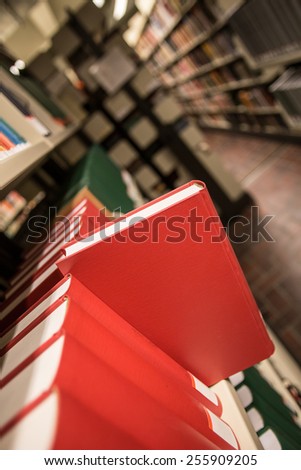 a book popping out of a bookshelf